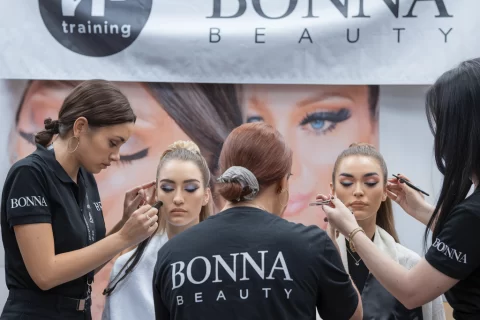 students learning eyelash extension techniques from experienced Bonna Beauty technicians